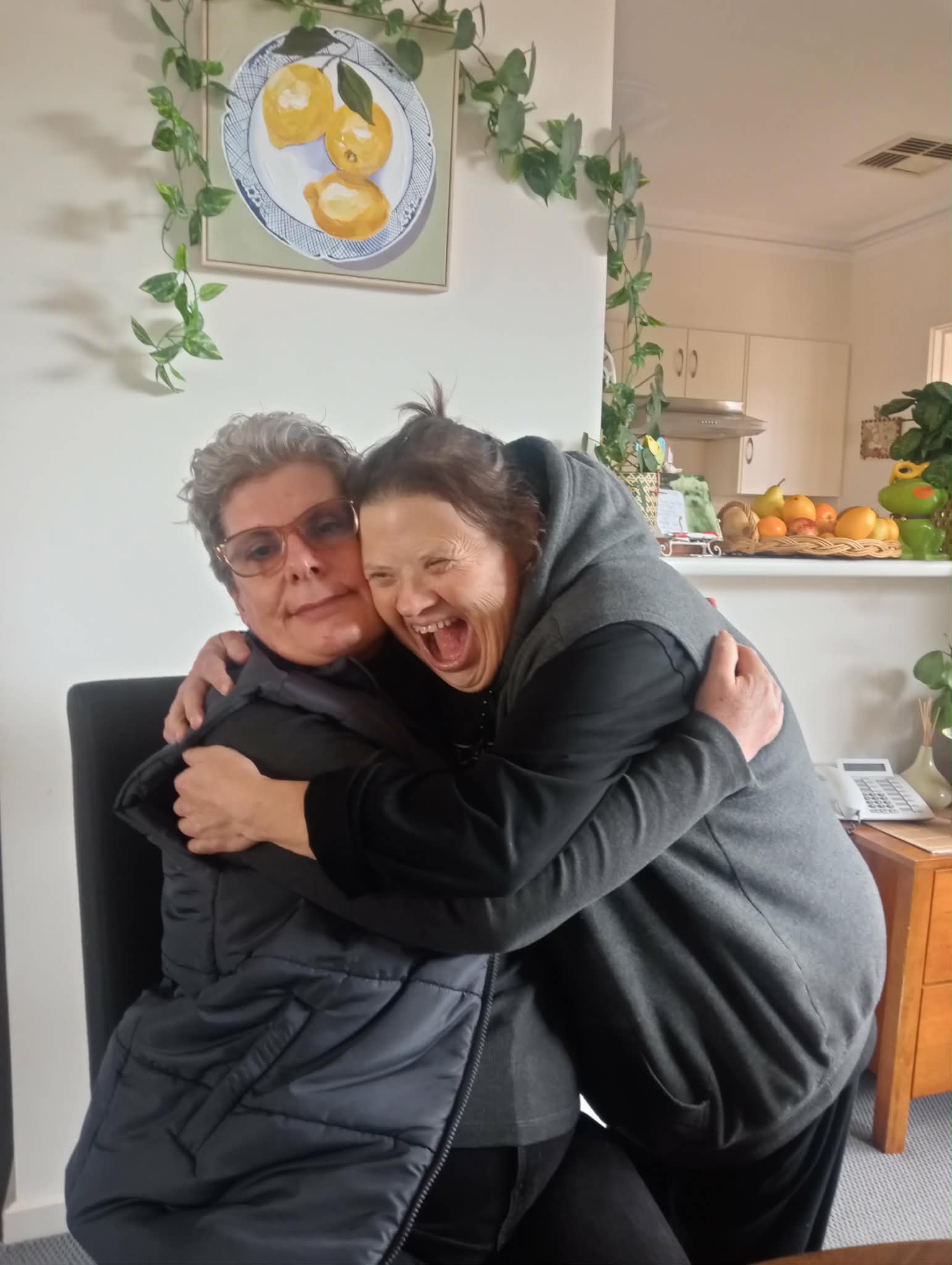 Two women hugging