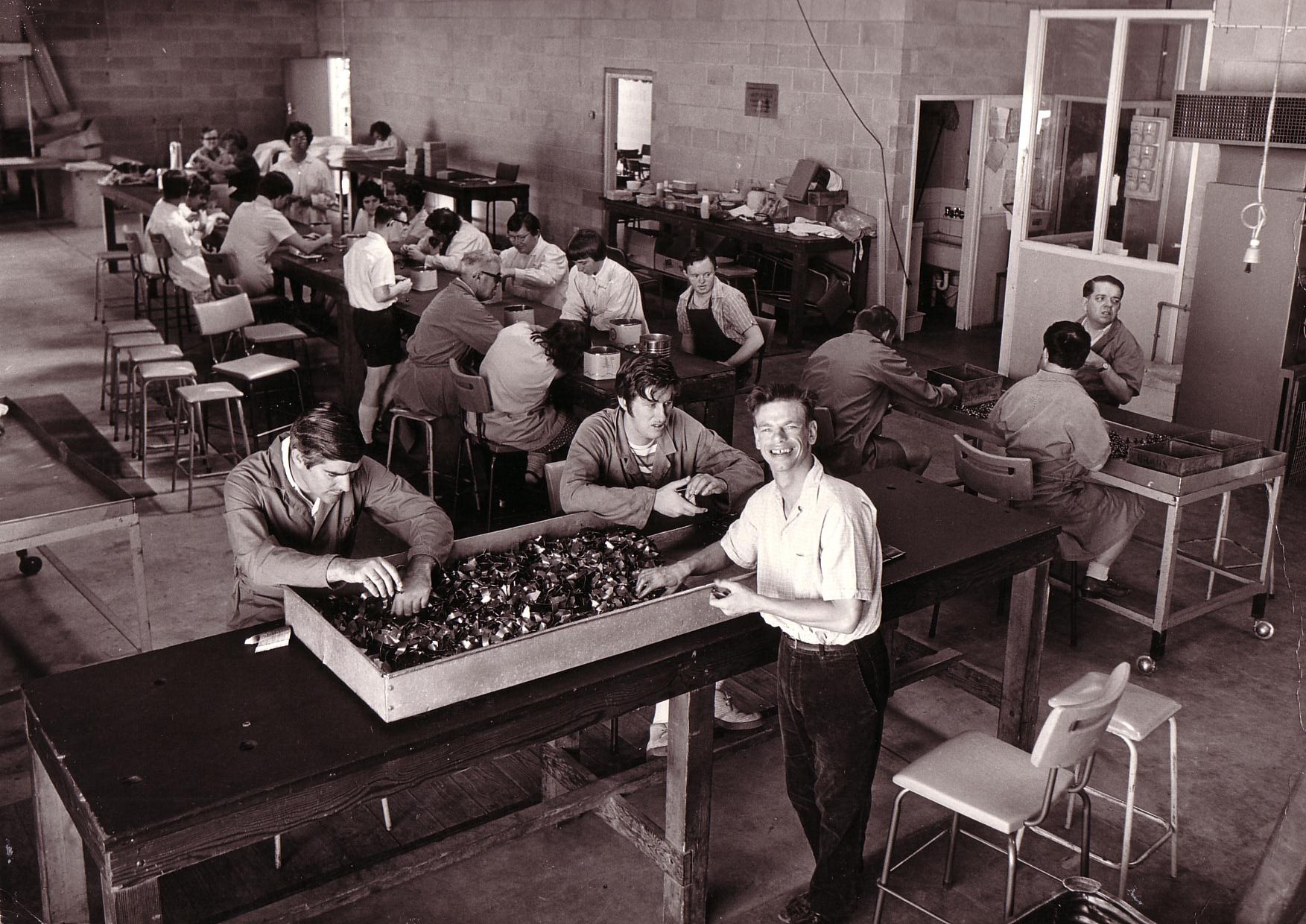Black and white image showing Orana staff and clients from many years ago.
