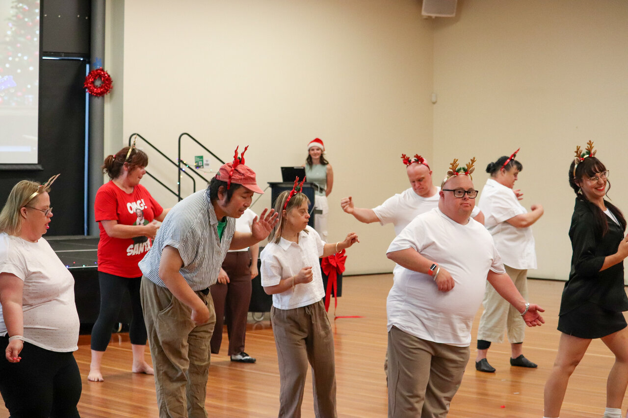 People in reindeer antlers dancing