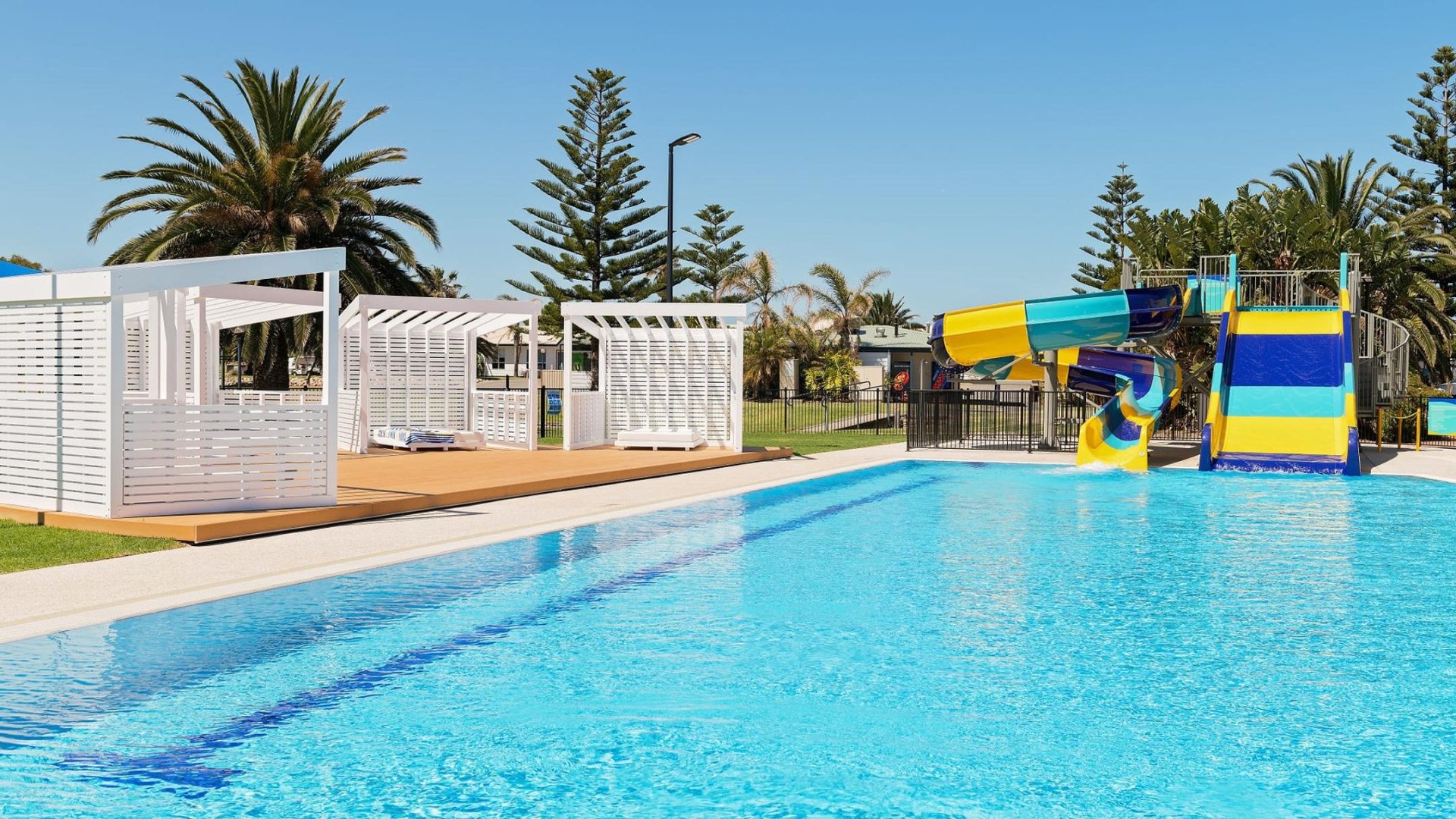 West Beach Park pool with colourful slide and shade huts