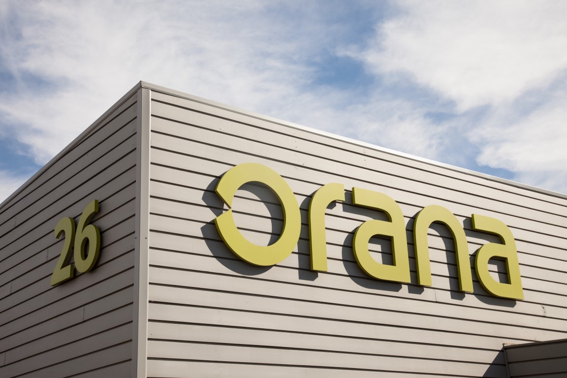Green sign saying 'Orana' on a grey background